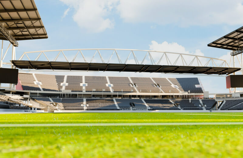 Rendering of the South end of Toronto Stadium at Exhibition Place with green grass under a cloudy sky